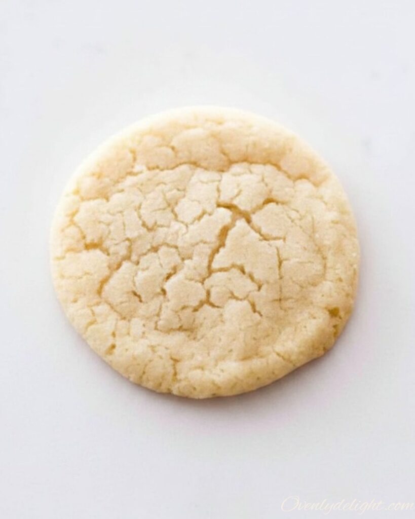 Homemade bakery-style sugar cookies coated in sugar, soft and buttery texture