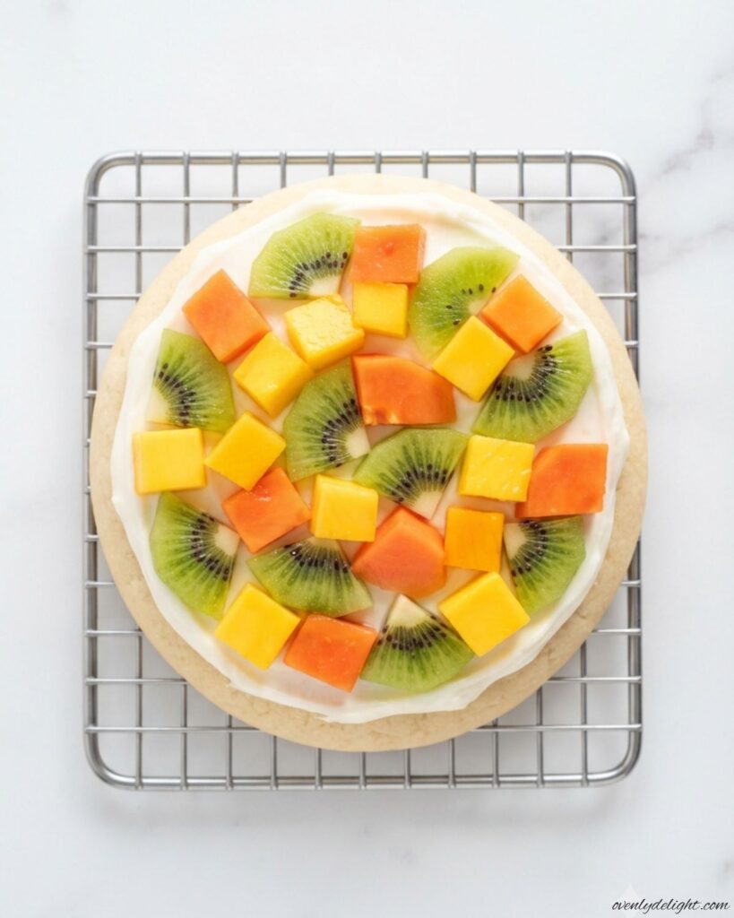Colorful Mini Fruit Pizzas with fresh seasonal fruit and sweet cream cheese topping on soft sugar cookie bases.