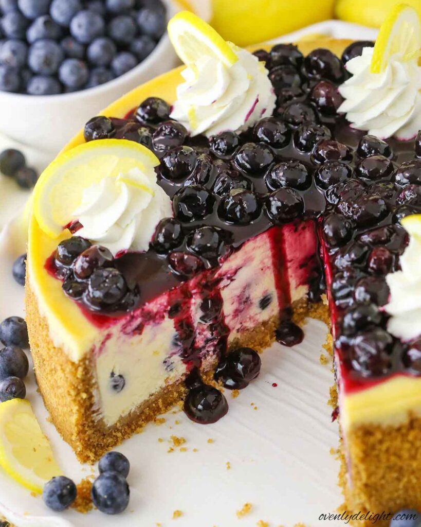 Creamy Lemon Blueberry Cheesecake topped with homemade blueberry compote.