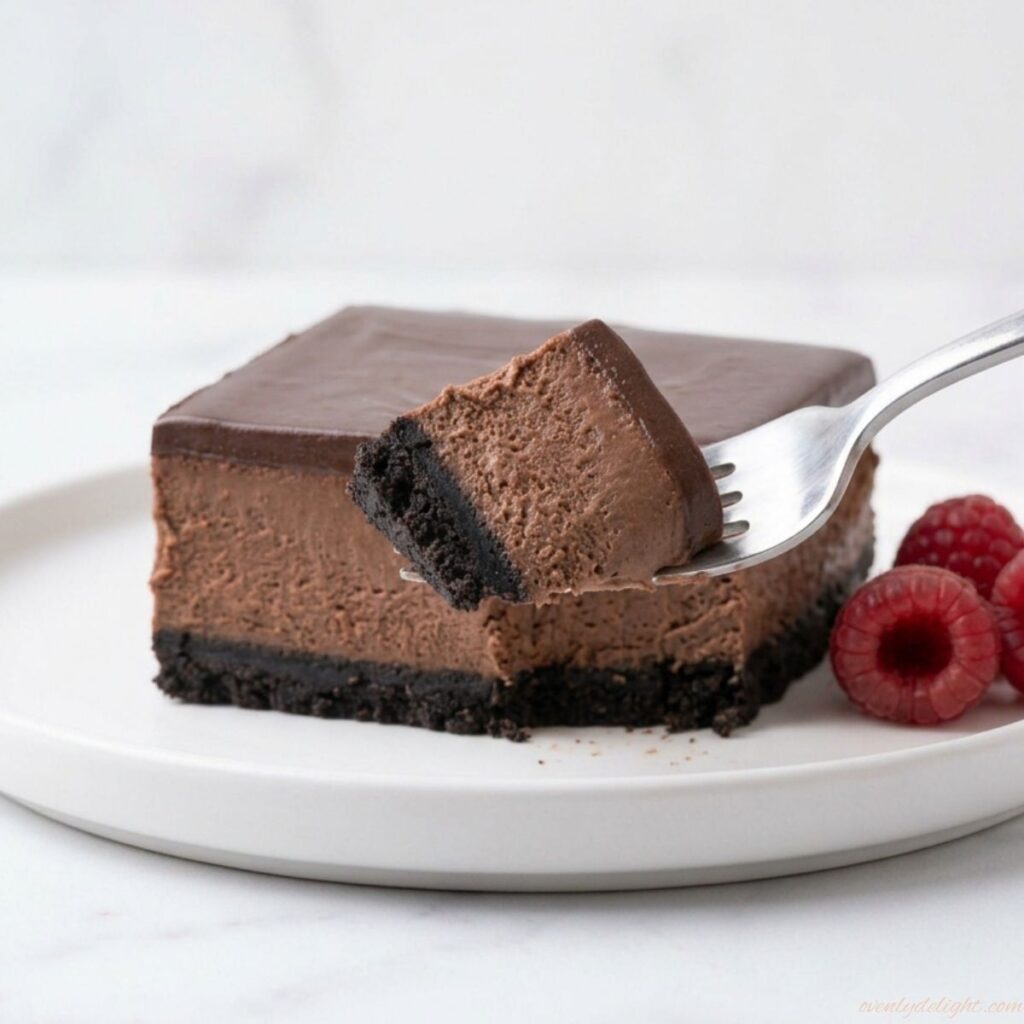 Rich chocolate cheesecake bars topped with smooth ganache layer