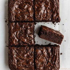 Bakery-style brownies with deep chocolate and golden edges