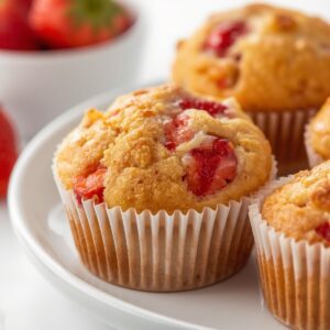 Fresh homemade Strawberry Muffins with juicy strawberries and bakery-style tops