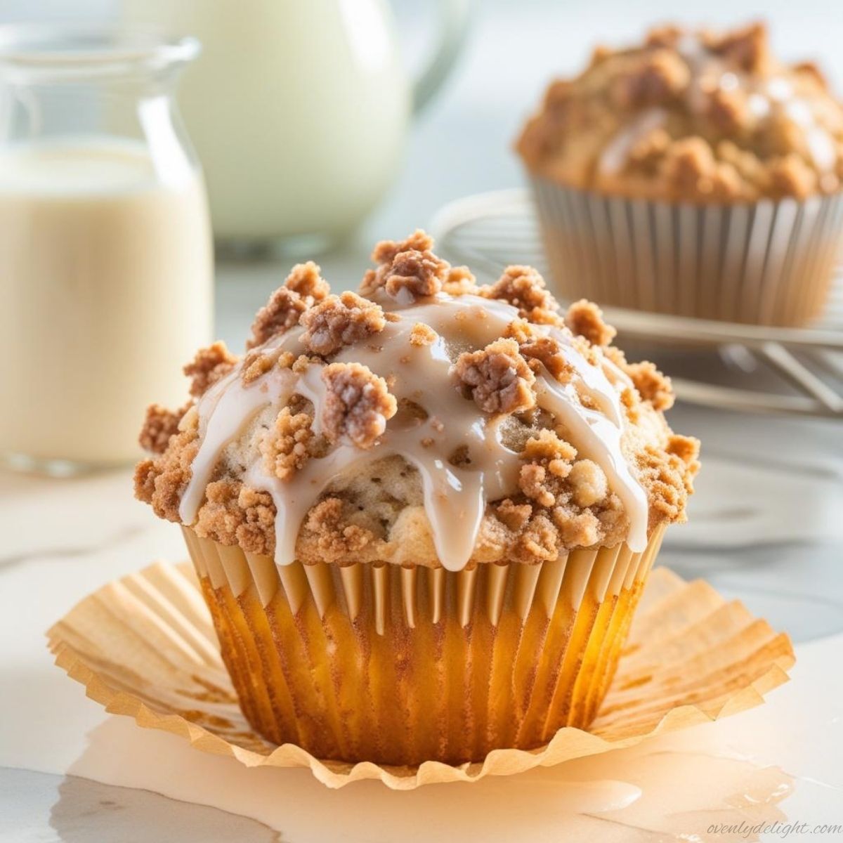 Homemade cinnamon coffee cake muffins with buttery crumble topping and warm spice flavor