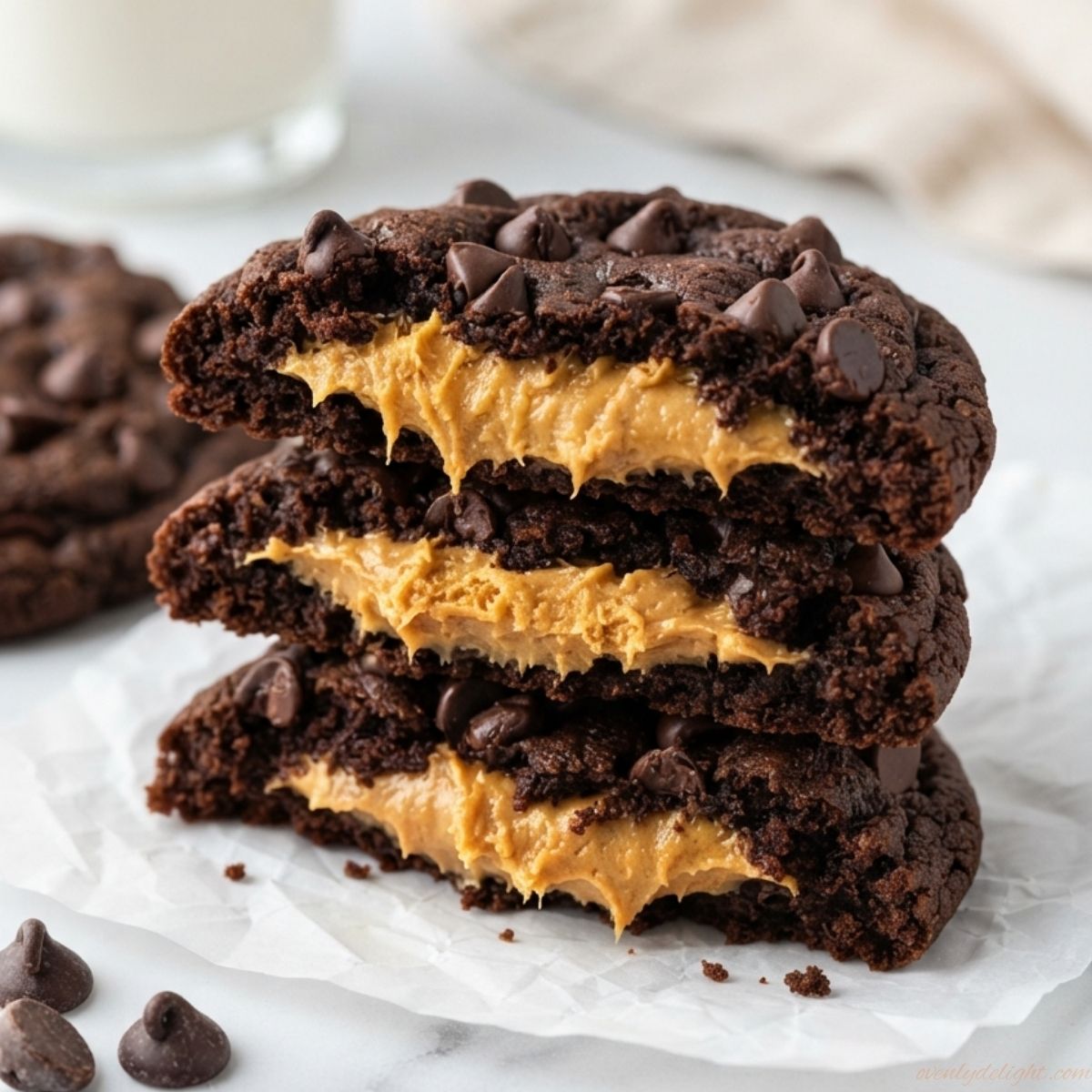 Bakery-style Reese's Double Chocolate Cookies made with cocoa, chocolate chips, and Reese's Peanut Butter Cups.