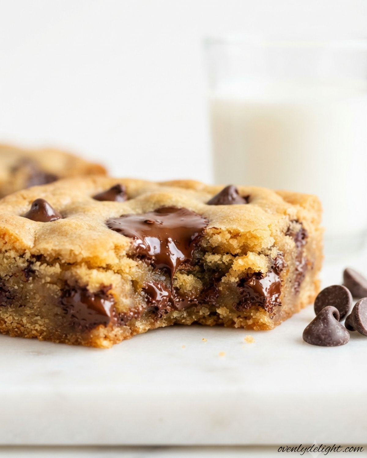 Brown Butter Chocolate Chunk Blondies stacked with gooey chocolate chunks and golden chewy edges