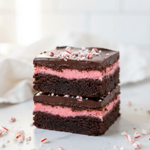 Chocolate Candy Cane Brownies decorated with peppermint candies for a holiday dessert.