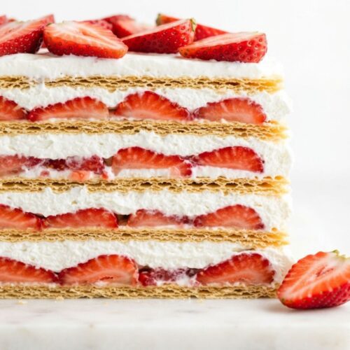 Creamy Strawberry Icebox Cake with layers of juicy strawberries, whipped topping, and graham crackers chilled until perfectly set.