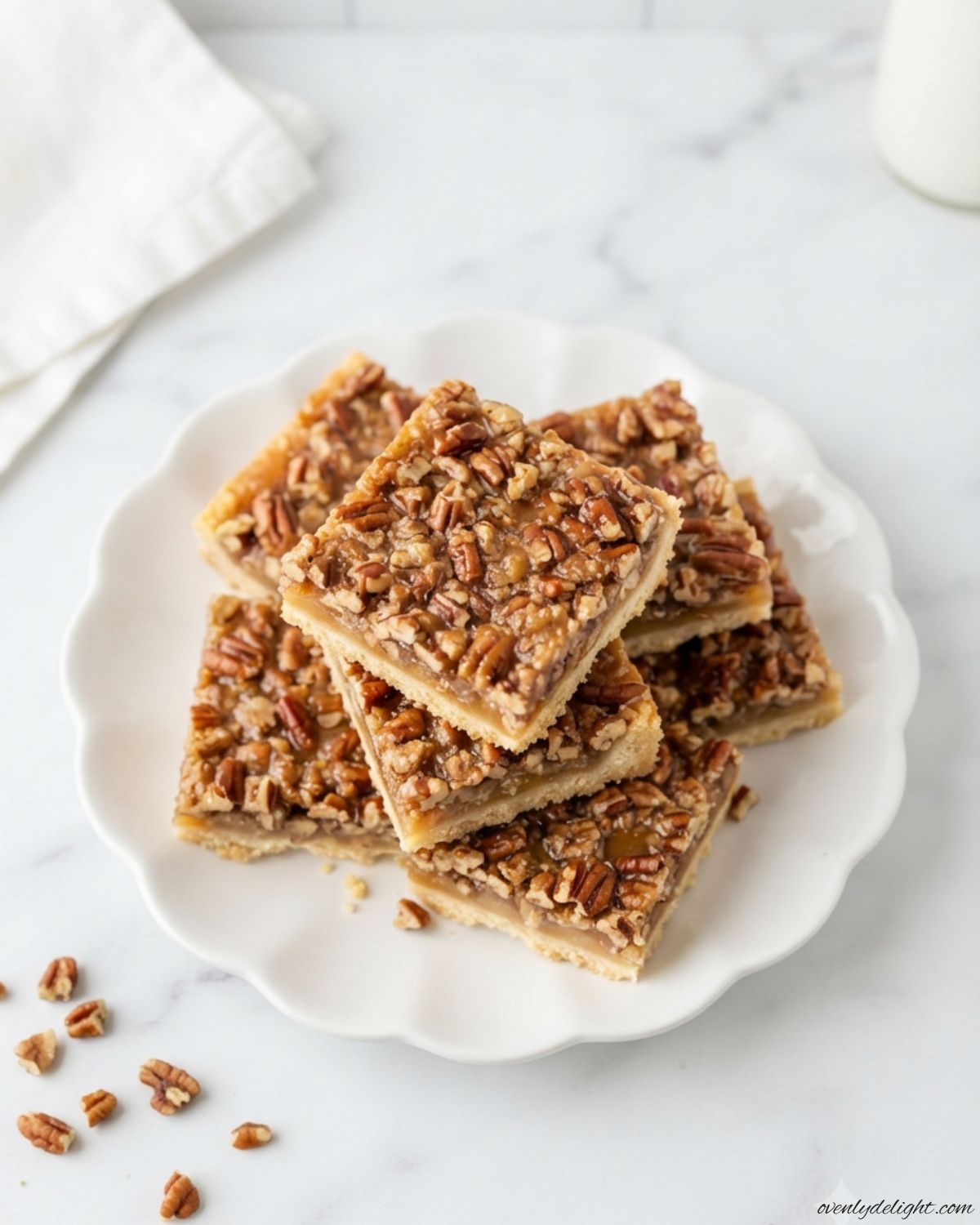 Delicious maple pecan dessert bars made with toasted pecans and a buttery homemade shortbread crust.