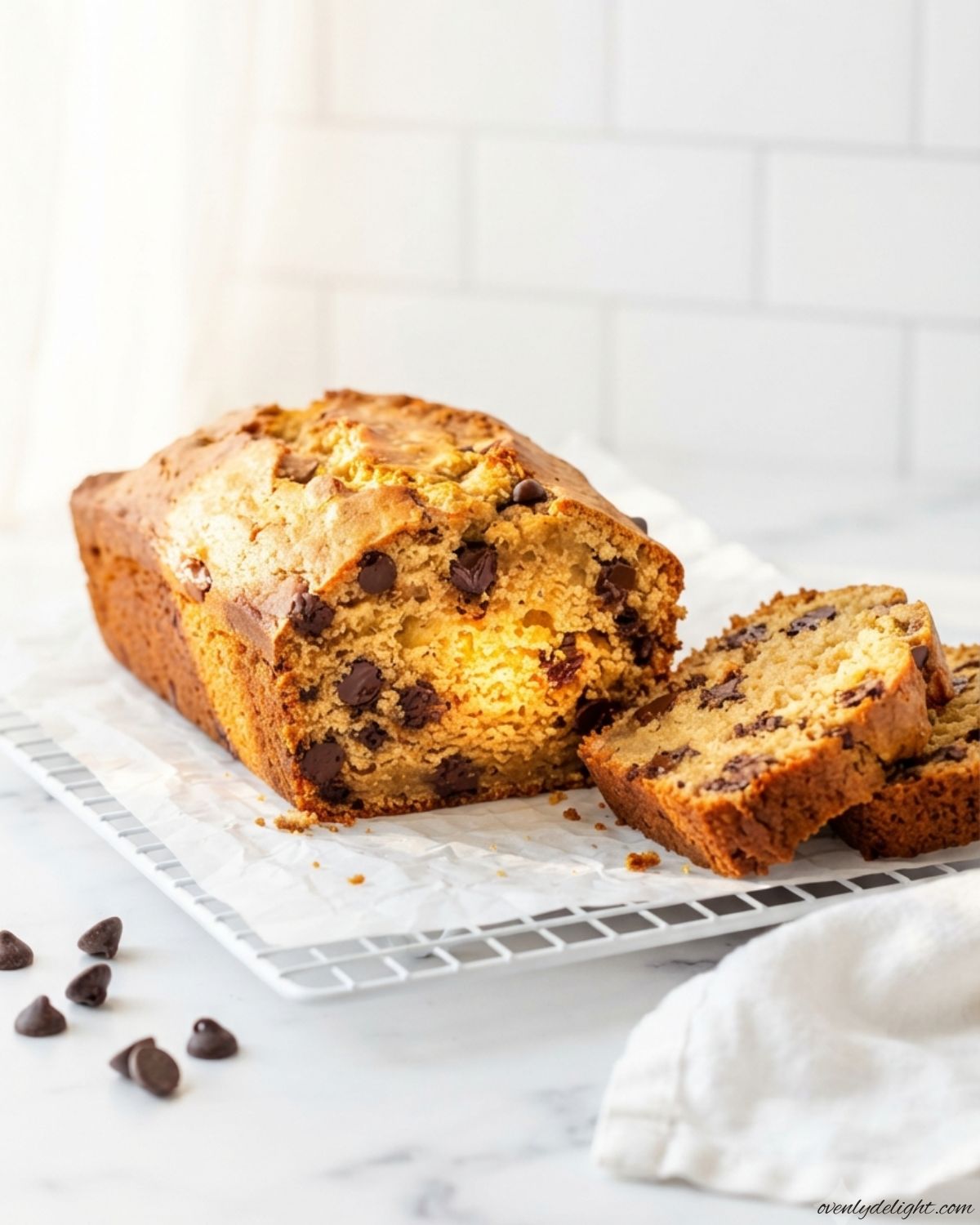Freshly baked peanut butter chocolate chip bread loaded with chocolate chips and served as a dessert