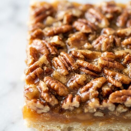 Homemade maple pecan bars with a buttery shortbread crust and rich maple pecan filling.