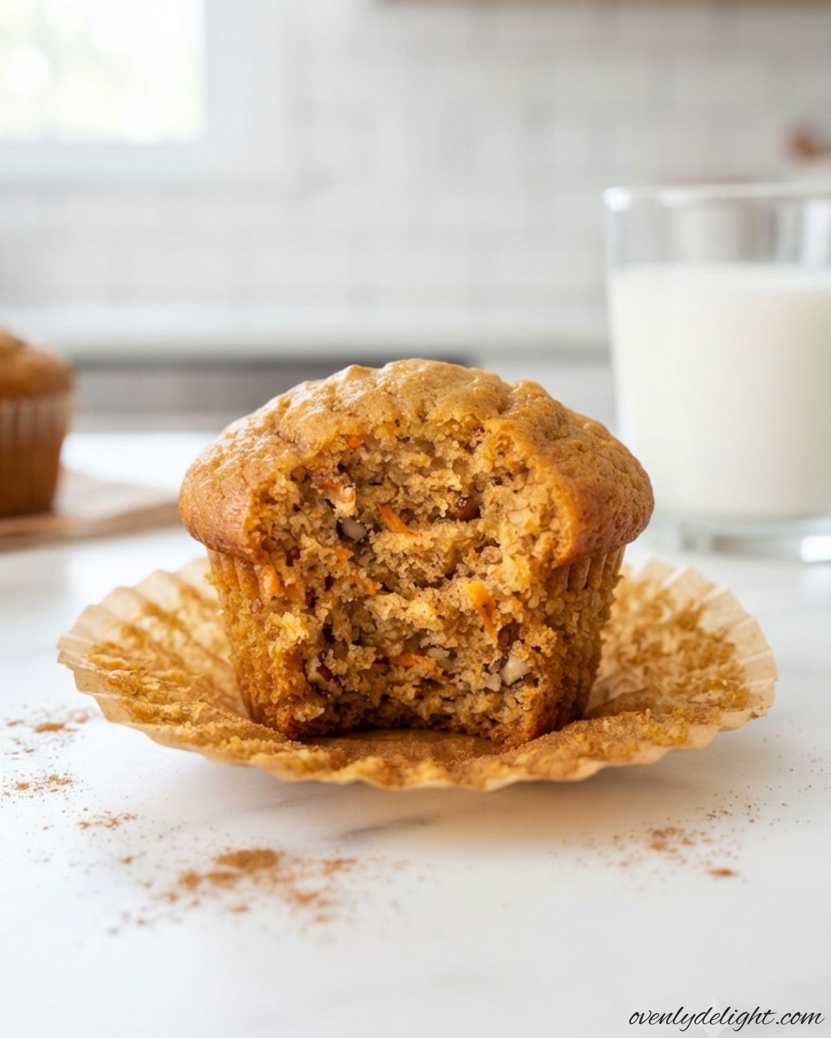 Homemade carrot cake muffins made with freshly grated carrots, warm spices, and a soft, tender crumb.
